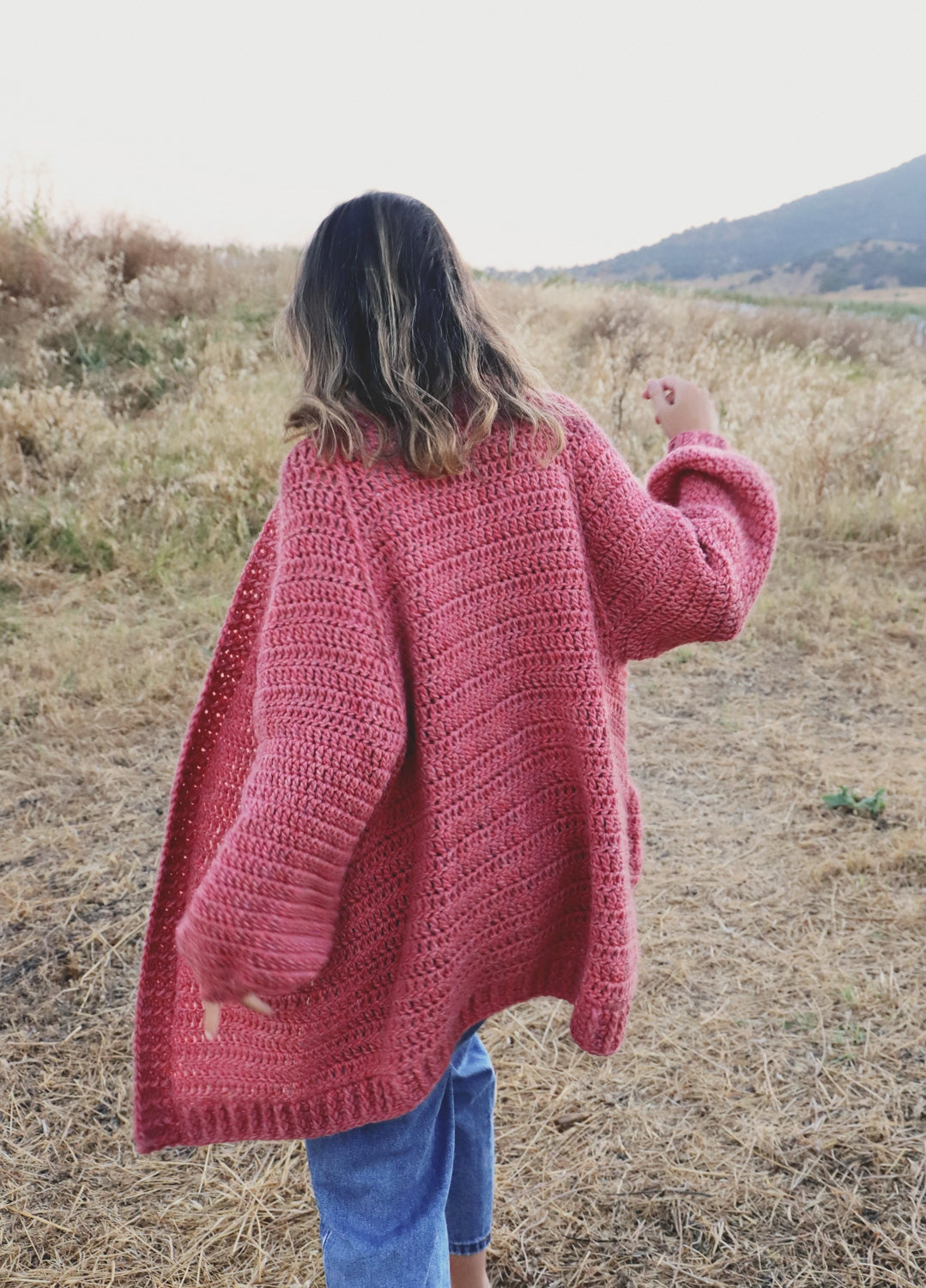 Cardigan with outlet hood and pockets