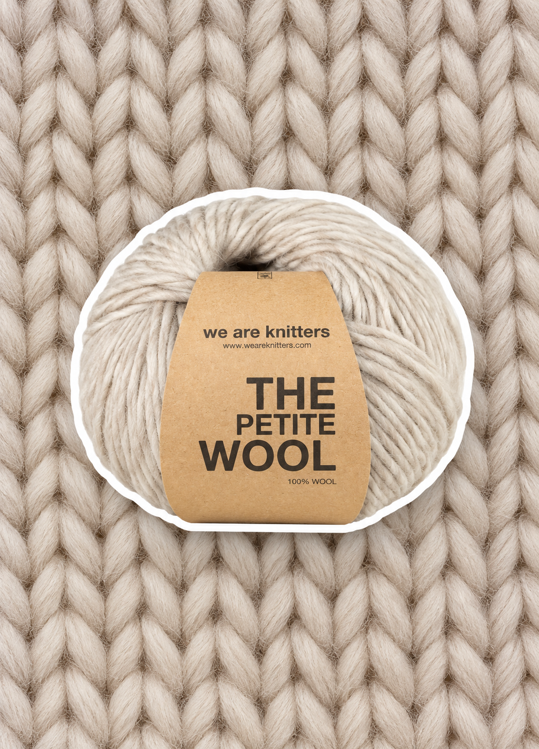 Petite Wool Spotted Beige yarn ball on a matching knit swatch