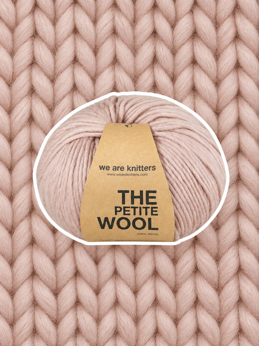 Petite Wool Spotted Mauve yarn ball on a matching knit swatch