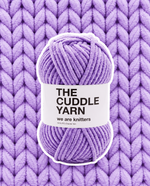 The Cuddle Yarn Lilac chenille skein on a matching knit swatch