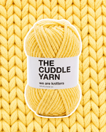 The Cuddle Yarn Yellow chenille skein on a matching knit swatch